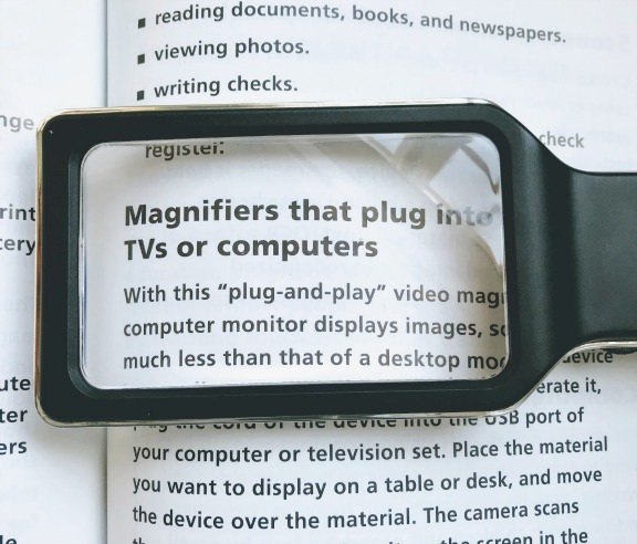 hand held magnifying glass