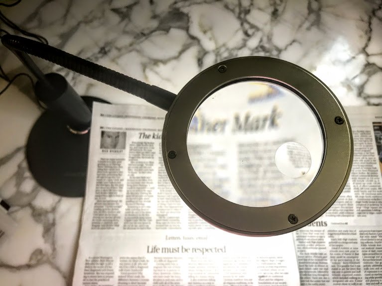 a magnifying desk lamp - a macular degeneration aid to turn your printed material into large print newspapers