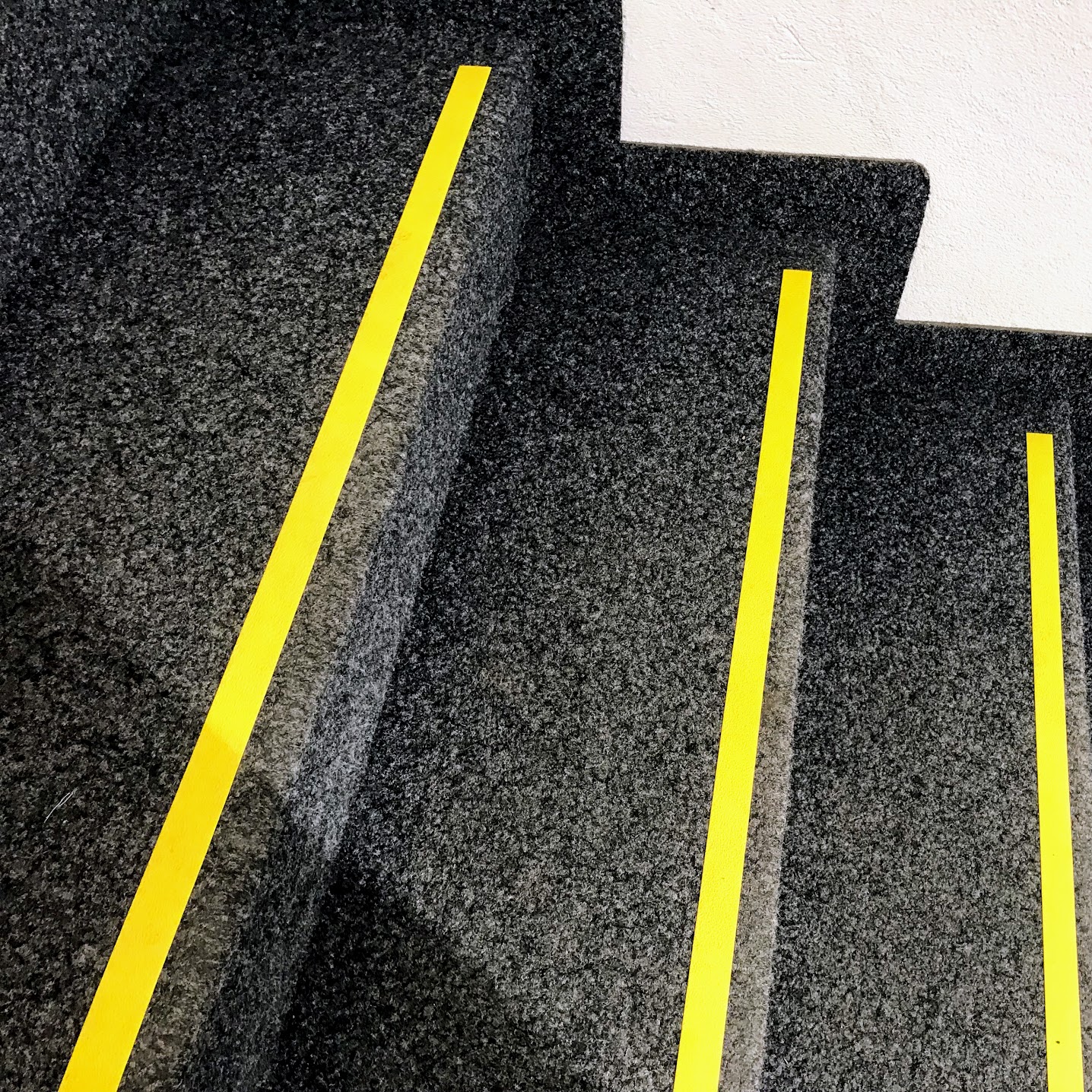 stairs with yellow stripe tape